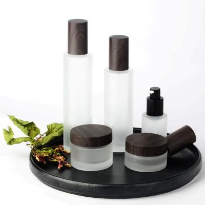 China Personal Packaging 20g 30g 50g 30ml 100ml Plastic Black Wood Lid Skin Care Lotion Pump Glass Bottle/Cosmetic Frosted Glass Container And Wood Lids for sale