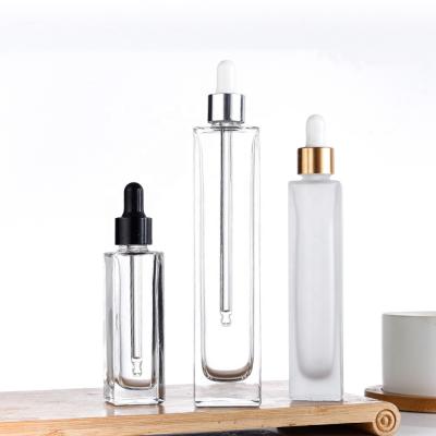 China New Style 30ml 50ml 100ml Square Cosmetic Rectangle Thin Clear Glass Dropper Bottles For Massage Essential Oil for sale