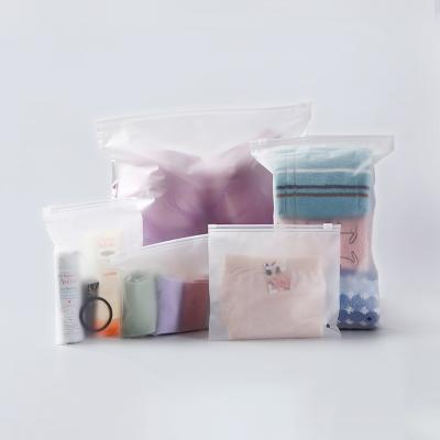 China Eco-friendly Wholesale Frosted Custom Clothing Packaging Bag PE Slider Zipper Poly Bag T-shirt Plastic Zip Lock for sale