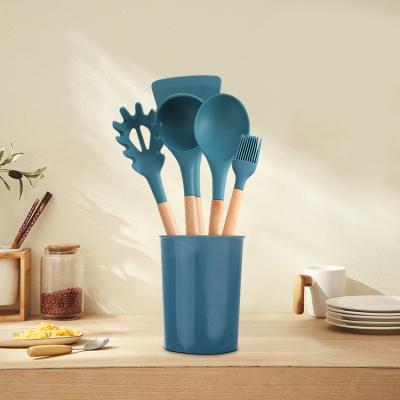 China Wholesale Viable Easy To Clean 9 Piece Silicone Pot Non Stick Heat Resistant Kitchenware With Wooden Handle for sale