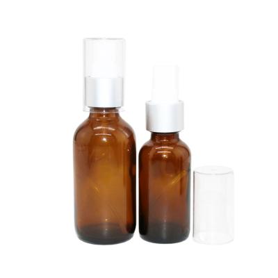 China Cosmetic 2 Ounce Amber Glass Round Bottles With Spray Top for sale