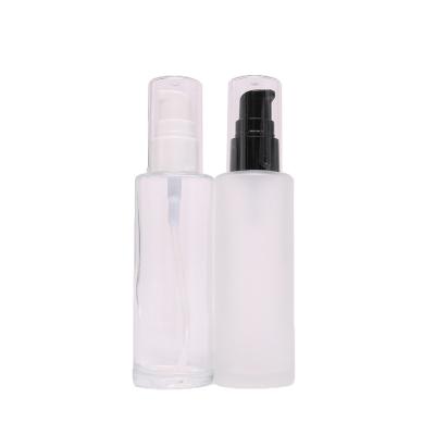 China 20ml 30ml 100ml Flat Shoulder Essential Oil Cosmetic Serum Frosted Clear Glass Bottle With Lotion Cap for sale