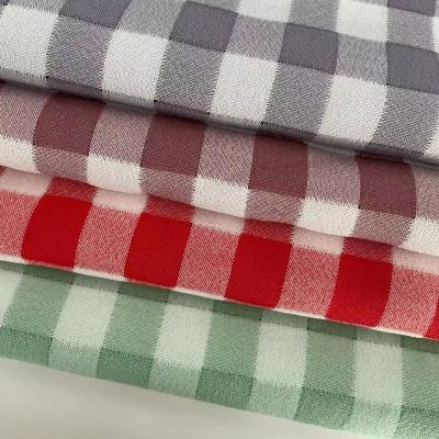 中国 DXX Hot Sale Ready Goods Soft Plaid 46% Polyester 46% Cotton 8% Polyamide Woven Fabric Check Fabric For Shirt And Skirt 販売のため