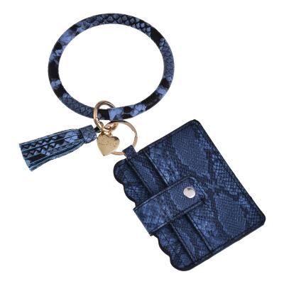 China Europe Style Wallet Trendy Trendy Bracelet With Key Chain Wholesale Price Leopard Leather Bracelet Tassel Charm Bracelet The Retro for sale