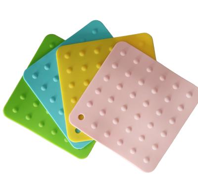 China Sustainable Hot Selling Custom Heat Insulated Silicone Pad Round Square Shaped Silicone Mat Pad for sale