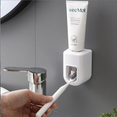 China Simple Design Wall Mounted Automatic Toothpaste Squeezer Toothpaste Dispenser Stored Hands Free For Bathroom for sale