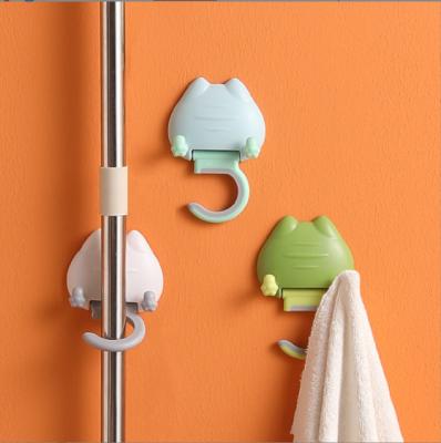 China Hot Sale Cartoon Cat Key Hangers Self Adhesive Bathroom Silicone Wall Hanging Mounted Hook Hanger Broom Clip Plastic Mop Holder for sale