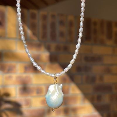 China Fashionable baroque pearl necklace dangling freshwater pearl necklace mini rice pearl chain for sale