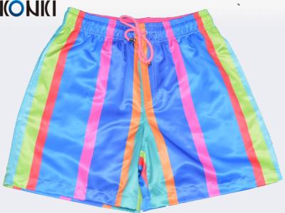 China Los pantalones de encargo de los colores multi de la sublimación del OEM nadan pantalones cortos/los pantalones cortos de la playa para la resaca del patín en venta