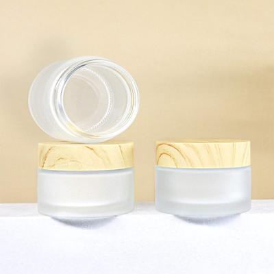 China Cosmetic 30g 50g 100g cosmetic packaging skincare body lotion glass empty container frosted cream jars with lid for sale