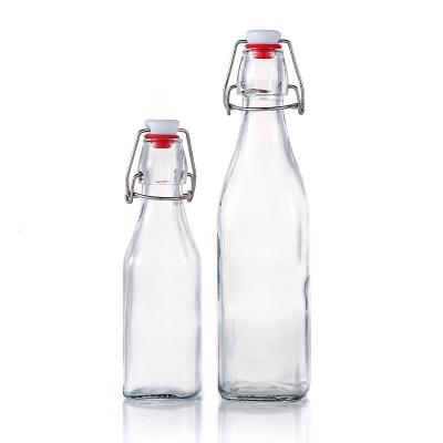 China Newest Design 250ml 500ml Square Beverage Bottle Glass Empt Beverage Bottles With Lid for sale