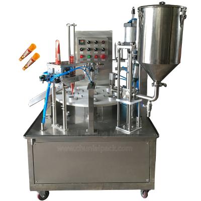 China Foods Calippo Type Delicious Ice Cream Cup Rotary Filling Sealing Machine for sale