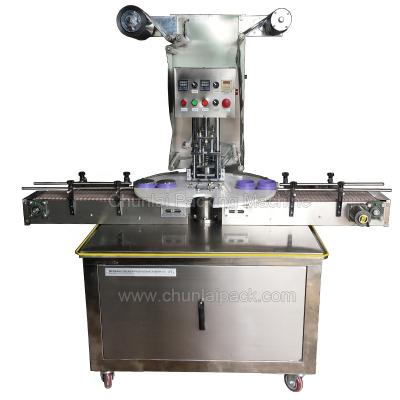 China Full Automatic High Speed ​​Cosmetic Products Paste Aluminum Foil Film Can Sealing Filling Machine for sale