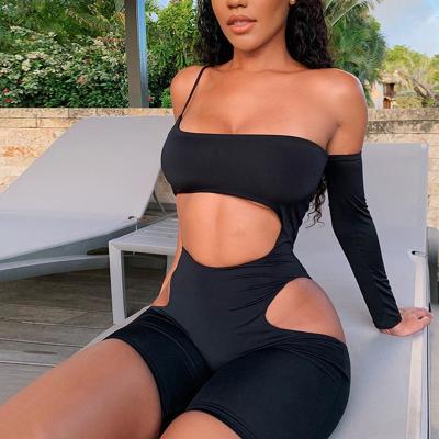 China 2021 QUICK DRY beach style hollow one-shoulder solid black playsuit asymmetrical rompers reduce neck skinny streetwear jumpsuit for sale