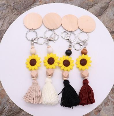 China Promotional Elastic Wooden Tassel Bracelet Circle Suede Beads Sunflower Key Chain Bead Silicone Key Chain for sale