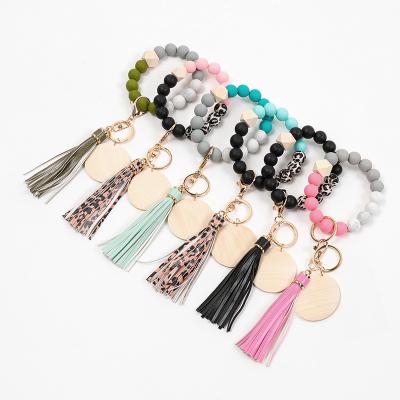 China Beautiful Elastic Wooden Beaded Monogram Silicone Beaded Monogram Key Chain Bracelet Macrame Promotional Customized Customized Gift for sale