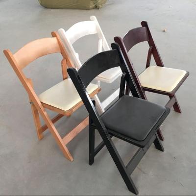 China Modern classic wooden padded folding chairs for banquet for sale