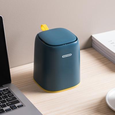 China Cute Creative Small Waste Bin Mini Press Sustainable Office Household Waste Bin With Lid Desktop Storage Box Wholesale for sale