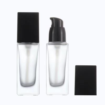 China Wholesale Empty Cosmetic Liquid Square Glass Serum Emulsion Container 30ml 40ml Travel Cosmetic Bottle With Pump for sale