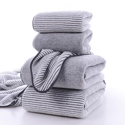 China Compressed Good Quality Gray Stripe Bamboo Carbon Fiber Face Towel Bath Towel For Beach for sale