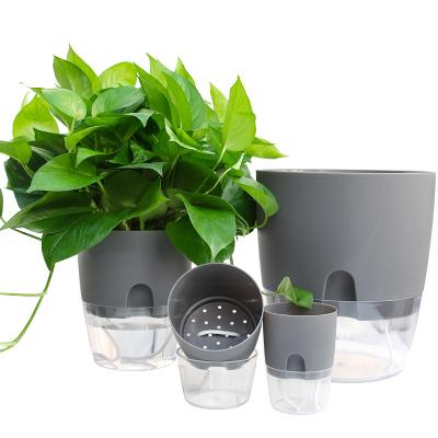 China Modern transparent plastic creative double layer flowerpot lazy automatic water absorption for sale