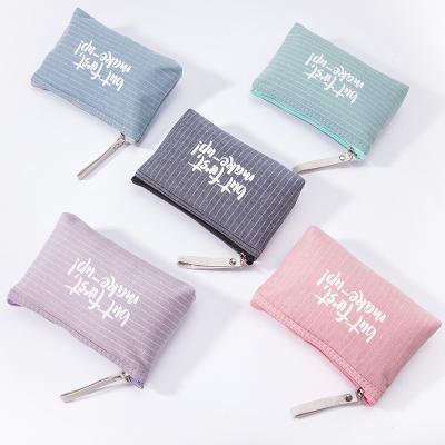 China Normcore/Waterproof Portable Student Color Letter Makeup Bag Canvas Cosmetics Storage Bag Minimalist Wholesale Custom Free Gift Bag for sale