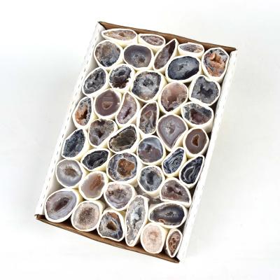 China China Wholesale Natural Crystal Mineral Agate Hole Fortune Lei Male Egg Crystal Specimen Box for sale