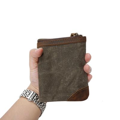 China Waterproof In Canvas Waterproof Men's Retro Wax Oil Stock Wallet Handmade Foldable Short Wallet for sale