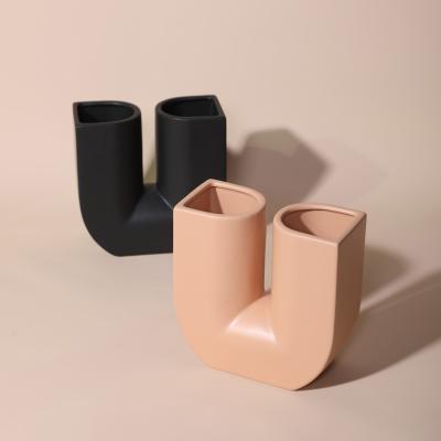 China Ware ceramic vases wholesale creative nordic style indoor living room deco design office u-shape ceramic vase art open vase for wedding for sale