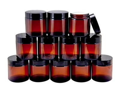 China New Personal Care 120ml Amber Cosmetic Packaging Round Glass Jars With Black Lids for sale