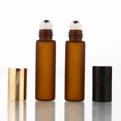 China Personal Care 10ml Amber Frosted Glass Roll On Perfume Bottle With Stainless Steel Roller And Black Aluminum Lid Maker for sale