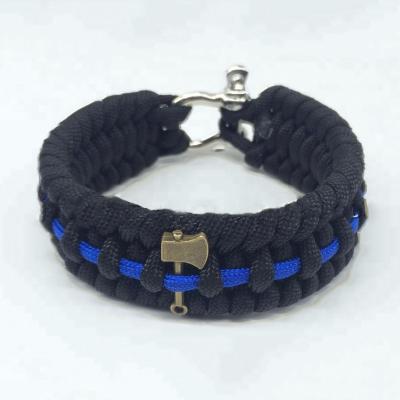 China CLASSIC handmade thin blue line srvival paracord bracelet fish tail weave paracord bracelet with ax charm for sale