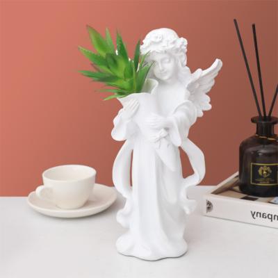 China Modern Europe Resin Bouquet Praying Angel Statue Vase Flower Arrangement Gift Art Resin Sculpture Home Decoration for sale