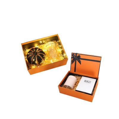 China Custom Printing Recyclable Logo Luxury Foldable Orange Rigid Paper Packaging Gift Box With Ribbon for sale