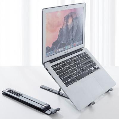 China (Size) Adjustable Portable Plastic Foldable Laptop Stand Stand Folding Portable Adjustable Laptop Stand for sale