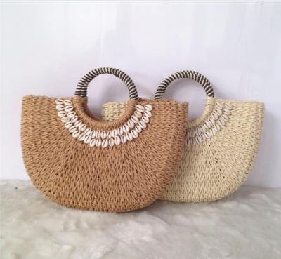 China Lady Wholesale Paper Rope Around Handbag 2021 Women Summer Rattan Tote Straw Beach Bag Simple Shell Grass Bucket Woven Bag Vacation for sale