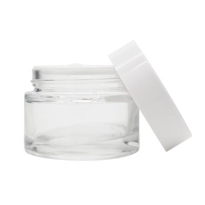 China Logo Factory Clear Empty Glass 50g Cosmetic Custom Jar For Cream With White Plastic Lid for sale