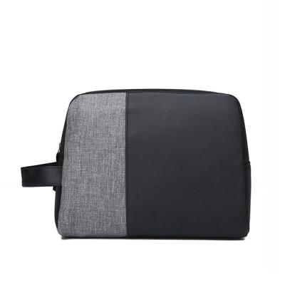 China Fashion tide cheap men's clutch bag durable men's bag large capacity casual patchwork handbag for sale