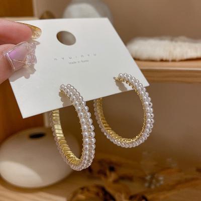 China Fancy Imitation Gold Plated Mini Pearl Hoop Earrings For Women Double Layer Real Double Layer Pearl Circle Earrings Fancy Gold Plated for sale