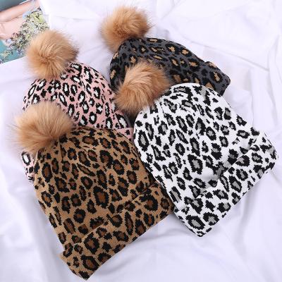 China COMMON Leopard Print Ball Hats For Women Winter Hat Pom Poms Fur Hat Fashion Ladies Warm Knitted Beanies for sale