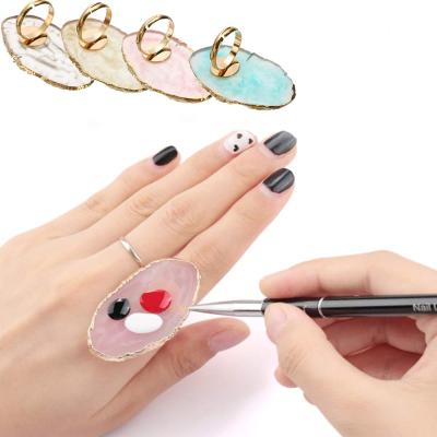 China Cosmetic Polish Nail Art Palette High Quality Gold Tip Edge Nail Palette Resin Paint Tray With Adjustable Finger Rings for sale