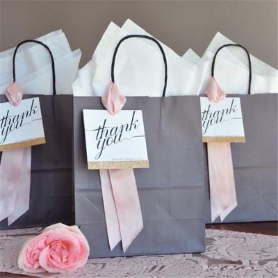 China Hot Selling BIODEGRADABLE Kraft Paper With Handle And Logo Printed Gift Bags for sale