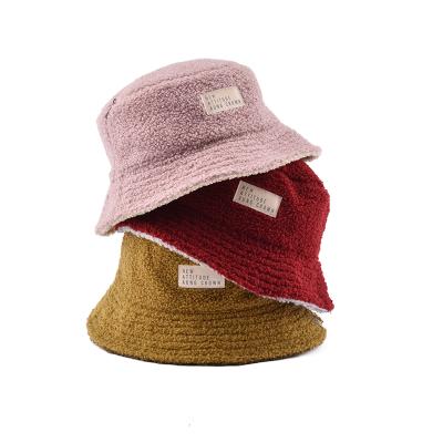 China Custom Woven Reversible Fashion Fisherman Winter Fleece Bucket Hat Label Bucket Hat With Chains for sale