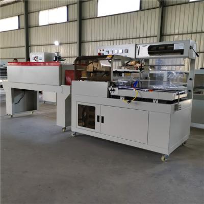 China Automatic L550 Shrink Box Packing Sealer L550 Shrink Paper Wrapping Machine With Sealing Tunnel For Big Small Box for sale