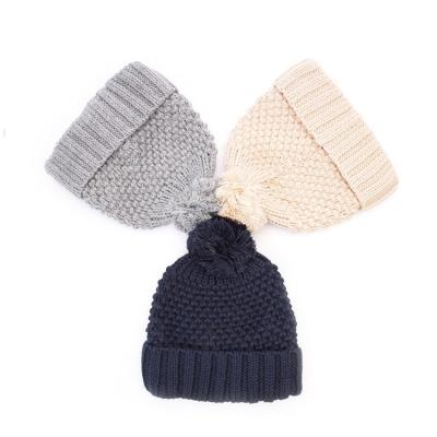 China Fashion Winter JOINT Wholesale Private Label Knitted Beanie Hats With Pom Pom for sale