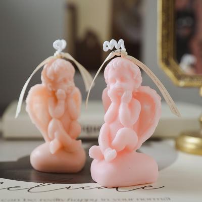 China Eco-friendly Wholesale Novelty Low Angle Baby Shaped Scented Angel Art Candle For Gifts for sale