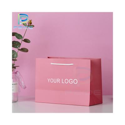 China Eco Friendly Recyclable Biodegradable Party Maker Bags Custom Packaging Pink Paper Packaging Bag With Flat Handle for sale