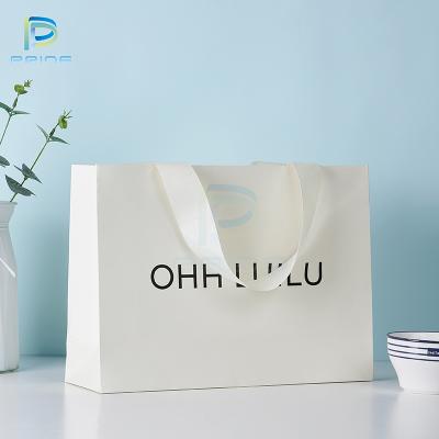 China Biodegradable Luxury Shopping Gift Bag Retail Garment Bag Custom Luxury Paper Bag For Clothes for sale