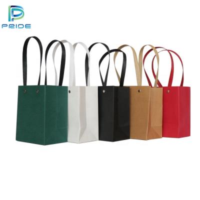 China Recyclable Logo White Brown Printed Kraft Craft Wholesale Shopping Paper Bags For Retail for sale