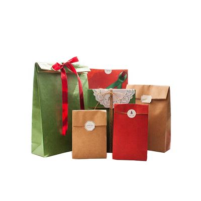 China Recyclable Exquisite Color Kraft Santa Claus Christmas Children Gift Packing Bag Kraft Paper Bag for sale